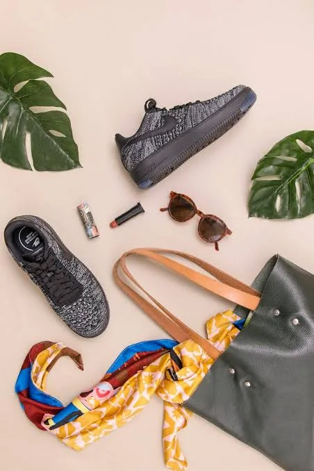 Flat lay of accessories and sneakers