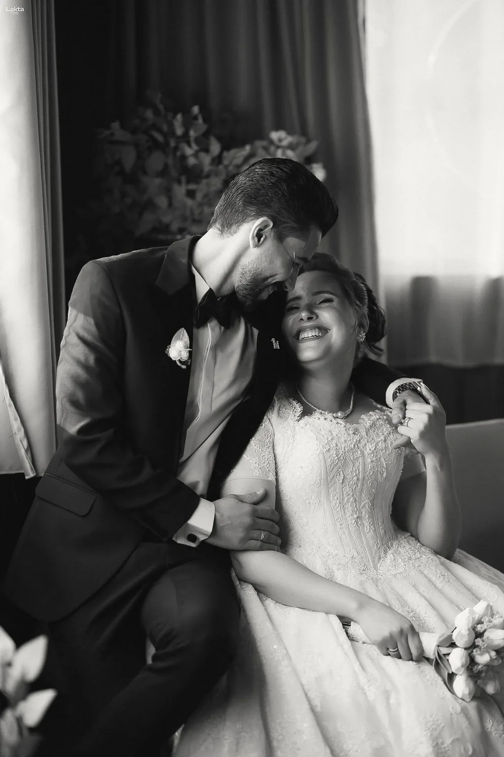 Bride laughing with the groom